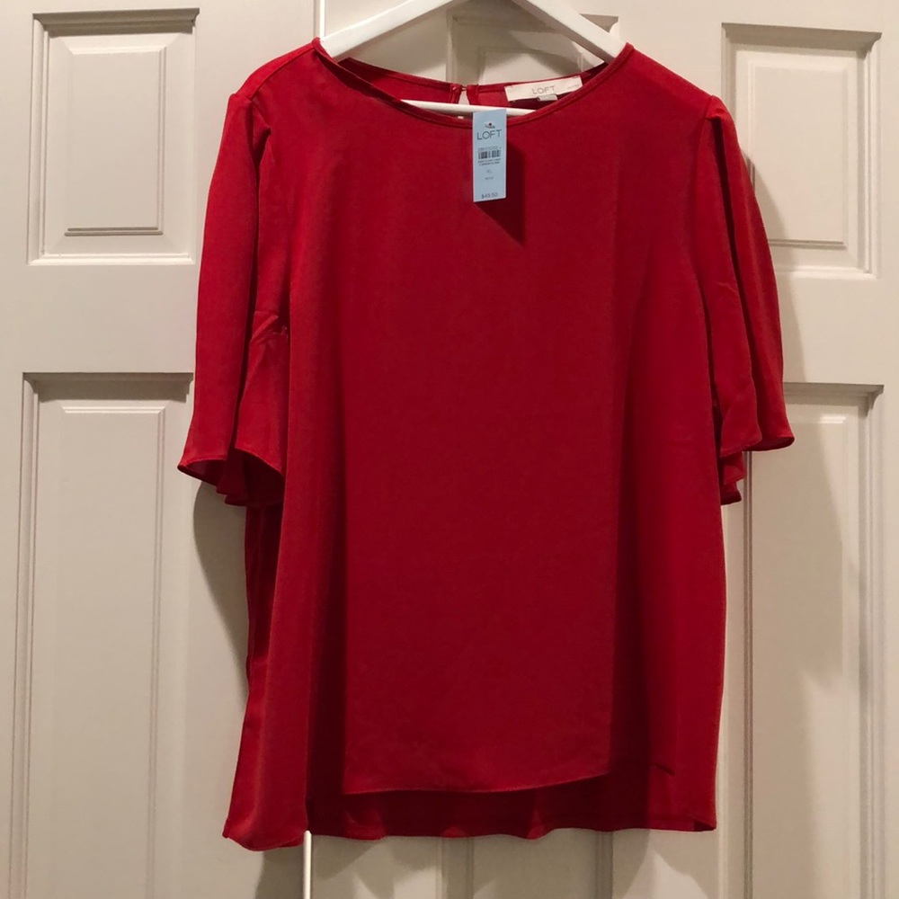 Red, mixed-media, flutter sleeve too.